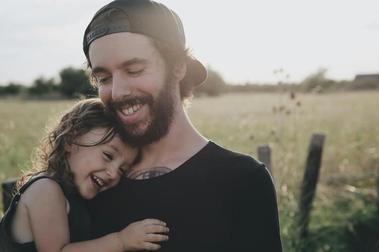 A daughter in her father’s arms