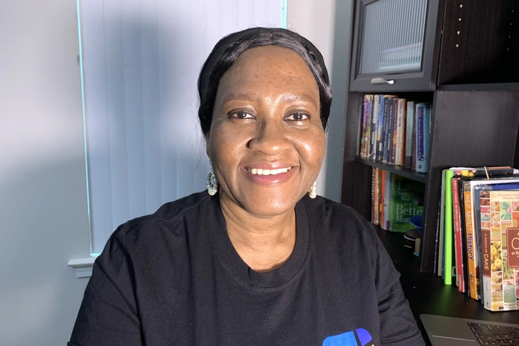 Ijeoma sitting at a desk